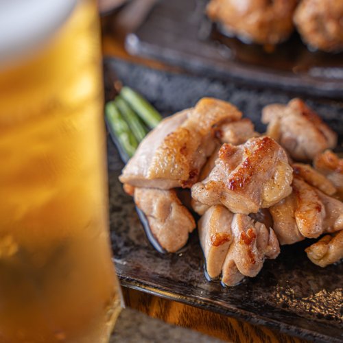 An izakaya dish and beer