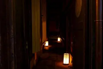 <p>Alley lit&nbsp;up by small lanterns</p>