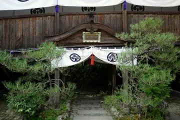 <p>Curtained path under a temple corridor</p>