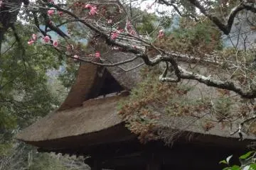 A bell platform sits to the right of the temple’s entrance gate. It has a nice thatched roof.