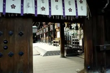 <p>Donated barrels of sake on display within the shrine</p>