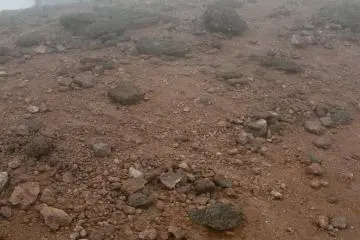 <p>The distinctive reddish rock dust near the summit</p>