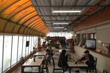 Customers enjoying snacks and coffee in Tado Green Farm cafe (Photo: PPF)