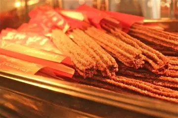 Churro's! To purchase one of these delicious spanish doughnuts, visit the main stand located at the Arabian Coast port-of-call.