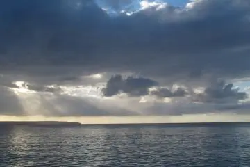 <p>Sun setting on a beautiful day in paradise.</p>