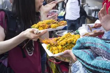 Stall serving up delicious plates of Spanish paella.