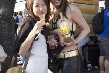 Festival punter striking a pose with a Jose Cuervo promoter.