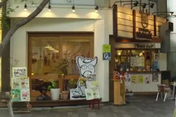 <p>From the outside you can see the cartoon representation of the owner, who likes cowboys, and the "take out" window.</p>