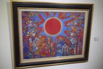 <p>A colorful painting from the permanent collection, reproduced on the outside of the museum</p>