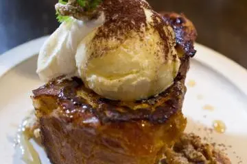 French toast with a scoop of vanilla bean ice cream drizzled in honey and walnuts. Heavenly!