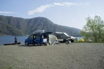 <p>Holiday makers camping around Lake Saiko.</p>