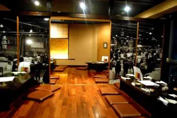 <p>Tables on the 3rd floor. The large photo in Black &amp; White covering the sliding doors shows the Fish Market in Tokushima</p>