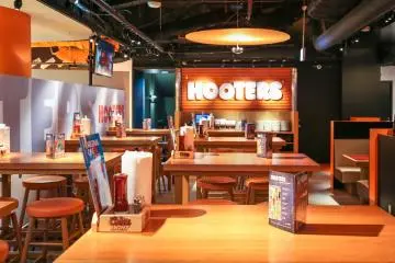 <p>Table and bar seating to the sides... will never be this empty</p>