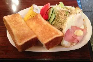 <p>Thick Toast, Eggs, Ham and a salad with creamy sesame dressing.</p>