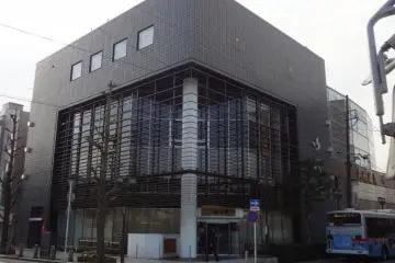 Kimi is located in this charcoal grey building just across from the station