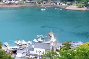 <p>The Sakitsu Cathedral Church is the largest building in the old town below.</p>