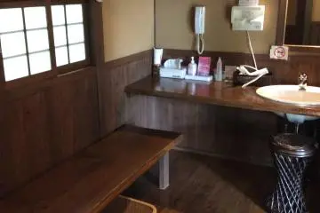 Dressing room of your own private bath. It is equipped with&nbsp;a hair dryer and bottles of moisturizer.