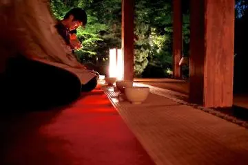 <p>Peaceful tea service at night</p>