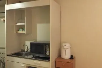 <p>Kitchen corner equipped with microwave and kitchen sink</p>