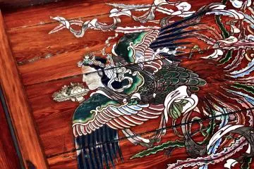 <p>Flying goddess is carrying a plate of cut fruits in her hand</p>