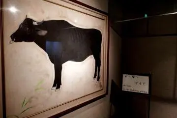 Cow painting hanging on the wall at the entrance, this must be female!