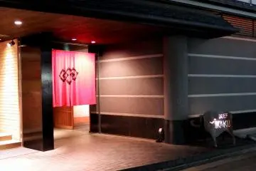 Lit-up entrance of 'Beef MIKAKU'