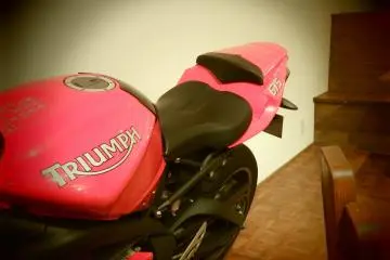 <p>Displayed motorbike. It looks like the owner of the restaurant is a fan of motorcycling</p>