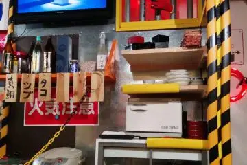 <p>A wielder's mask next to the TV stares you down, adding a bit of creep factor to an otherwise fun environment.&nbsp;</p>