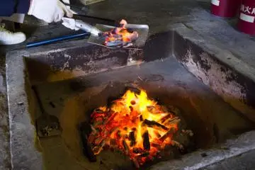 <p>Collecting charcoal to heat up the board for drying out tea leaves</p>