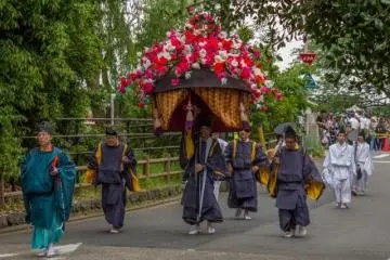 <p>The Aoi Matsuri (葵祭) 2014 in Kyoto City is a colorful event. This is a flower umbrella called furyu-gasa (風流傘). These furyu-gasa are sometimes called Hana-gasa or flower umbrellas and are decorated with artificial flowers</p>