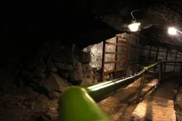 <p>There are lights inside the cave so that you can see the large blocks of ice stored here.</p>