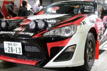 There's quite a lot of racing and souped up cars ready to race in their team's colors and sporting the companies' sponsorship stickers on them.&nbsp;