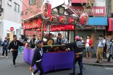 While some mikoshi are carried, others are pushed through the streets.