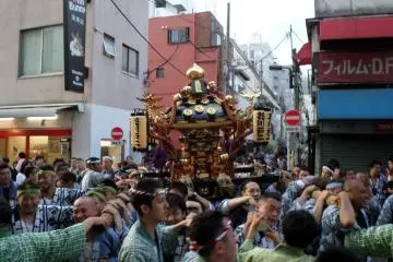 Dozens of mikoshi are marched through the streets during the three-day festival.