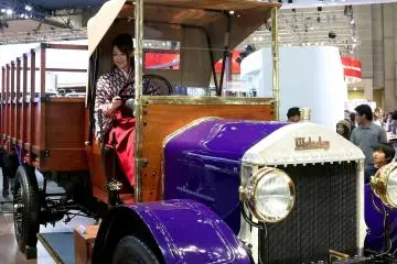 There were also many trucks at the show, including this old style vehicle with a beautiful model inside.&nbsp;
