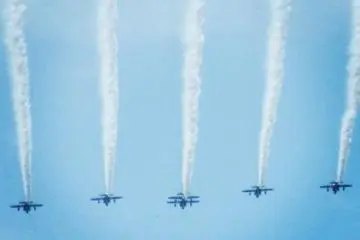 <p>Flying directly over the crowd</p>