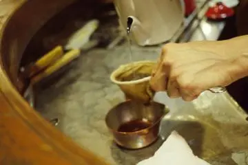 <p>The staff meticulously preparing coffee at the bar.&nbsp;</p>