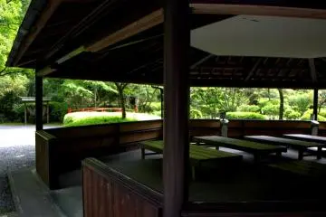 <p>The pavilion is a simple wooden structure with windows all around</p>