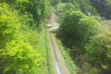 <p>Slide in the playground with cable car to GALA behind</p>