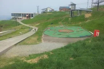 <p>Slide in the playground with cable car to GALA behind</p>
