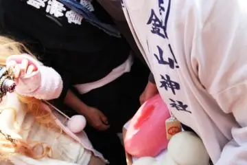 A man carrying penis and vagina rice cake