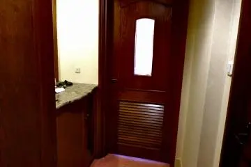<p>Standard double room has 'entrance hall', which is separated from a bedroom by a wooden door</p>