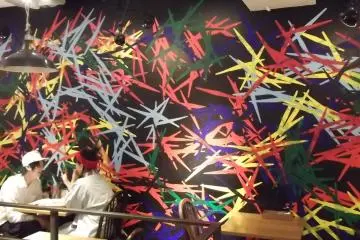 The zingy mural at the back of the room