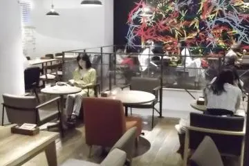 Low, comfortable chairs and simple wooden furnishings