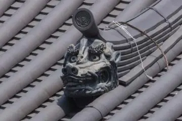 <p>Ryūzu Gawara (龍頭瓦) Dragon Head Tile on the roof of Ho'o-do of the Byōdō-in (平等院) in Uji City, Kyoto. There is a legend about these &ldquo;Dragon Head tiles&rdquo;. Uji is compared to a great dragon&rsquo;s palace, and the Uji River, which flows through it, is where the founder of Byōdō-in, Fujiwara Yorimichi, watches over his masterpiece as a dragon god. Dragons also come out quite often in Buddhist teachings as creatures which uphold Buddhist law. Dragons also are featured alongside snakes - which are symbols of fertility - in much folklore and legends in Japan</p>