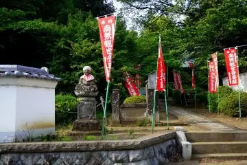 Red banners on either side of the path