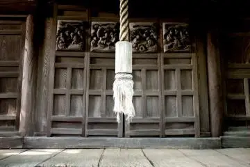 The doors are decorated with carvings of people