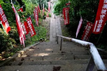 The building with the wood carving is at the top of many steps