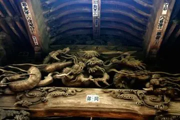 A fantastical dragon broods under the eaves