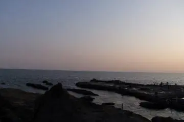 <p>Arms of rock stretching out to sea</p>